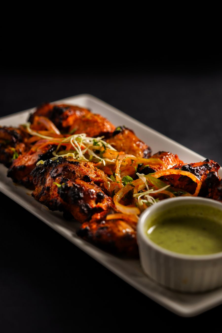 Grilled tandoori chicken with mint chutney and herbs