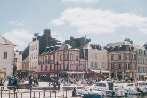 Free Explore the picturesque Honfleur harbor with historic buildings and vibrant activity. Stock Photo