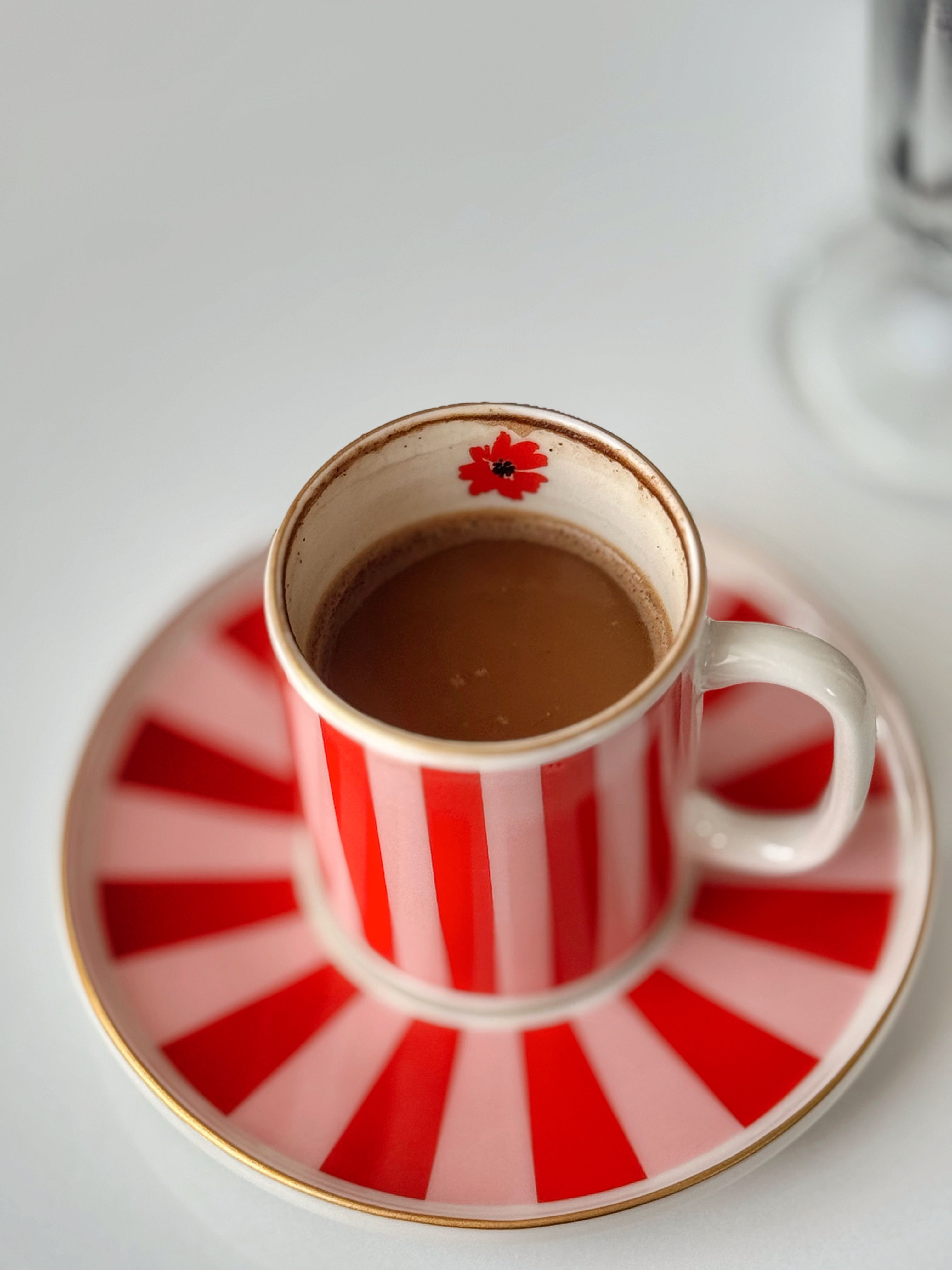 Red Striped Coffee Cup on Matching Saucer · Free Stock Photo