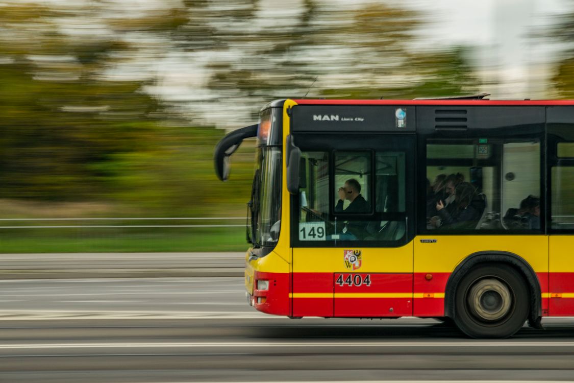 Dynamic Shot of City Bus in Motion on Roadway · Free Stock Photo