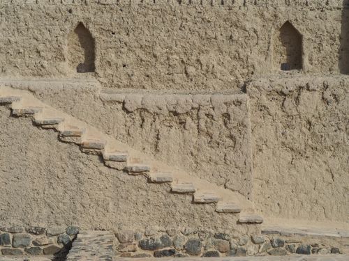 Free Textured mudbrick stairs leading up an ancient fortress wall in Oman. Stock Photo