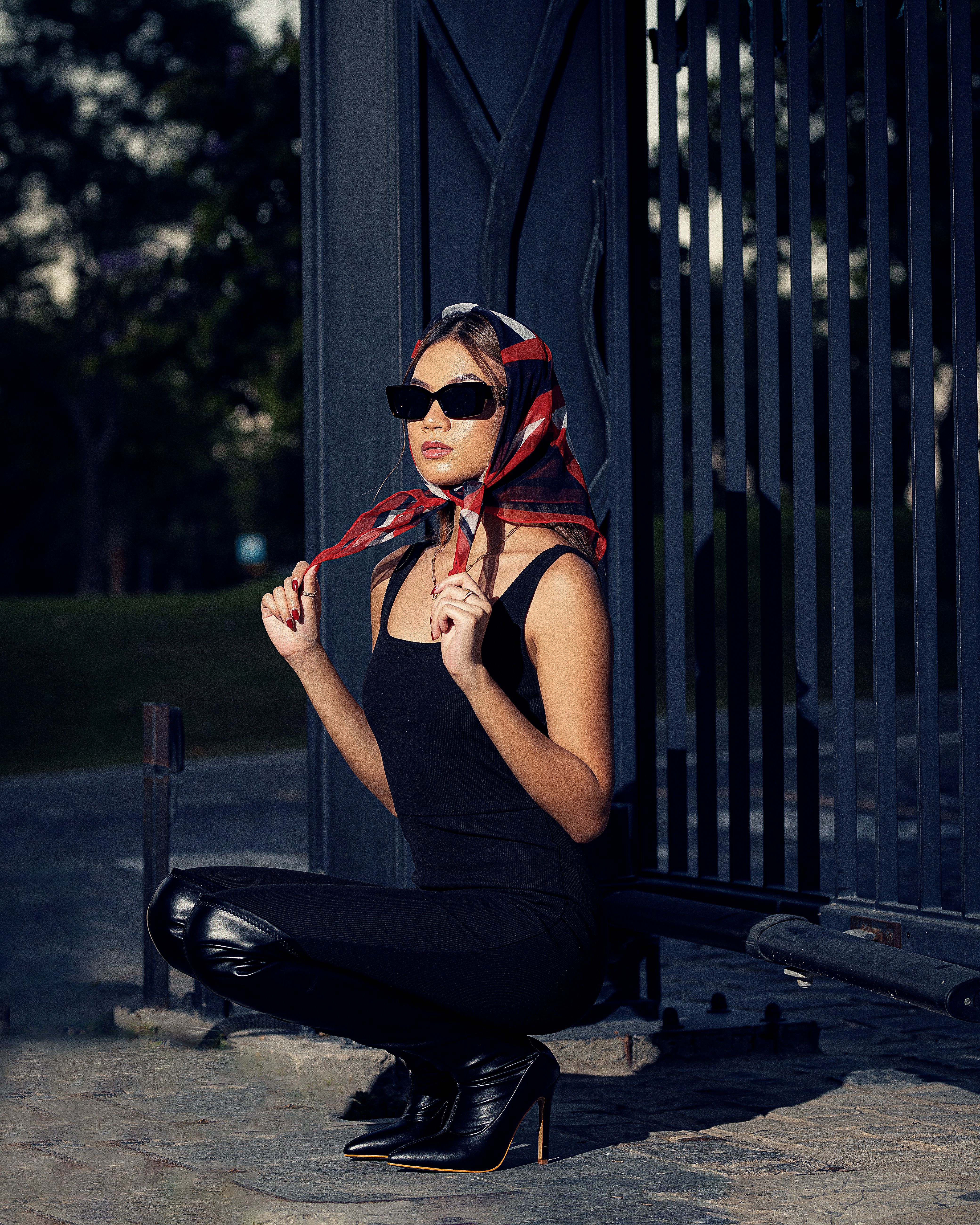 Stylish Woman Posing Outdoors in Sunglasses · Free Stock Photo