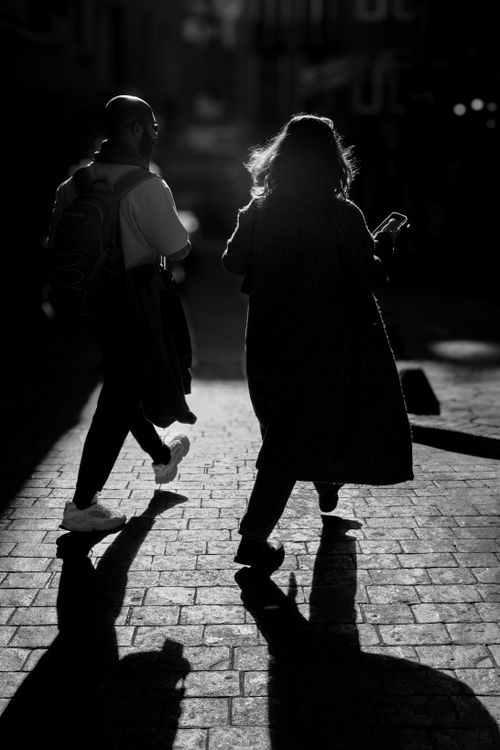 Free Silhouetted people walking in Istanbul with striking shadows and light contrast. Stock Photo
