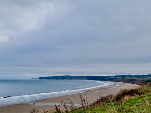 Free Explore the stunning coastline of Bridlington Beach, England, with dramatic cliffs and wide sands. Stock Photo
