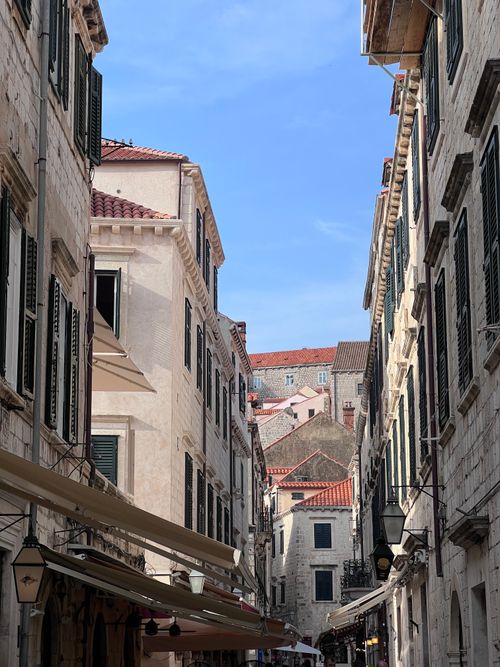 Free Explore the historic streets of Dubrovnik with stunning medieval architecture under a clear blue sky. Stock Photo