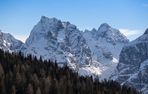 Free Breathtaking view of snow-covered peaks in Trentino-South Tyrol, Italy, under a clear blue sky. Stock Photo