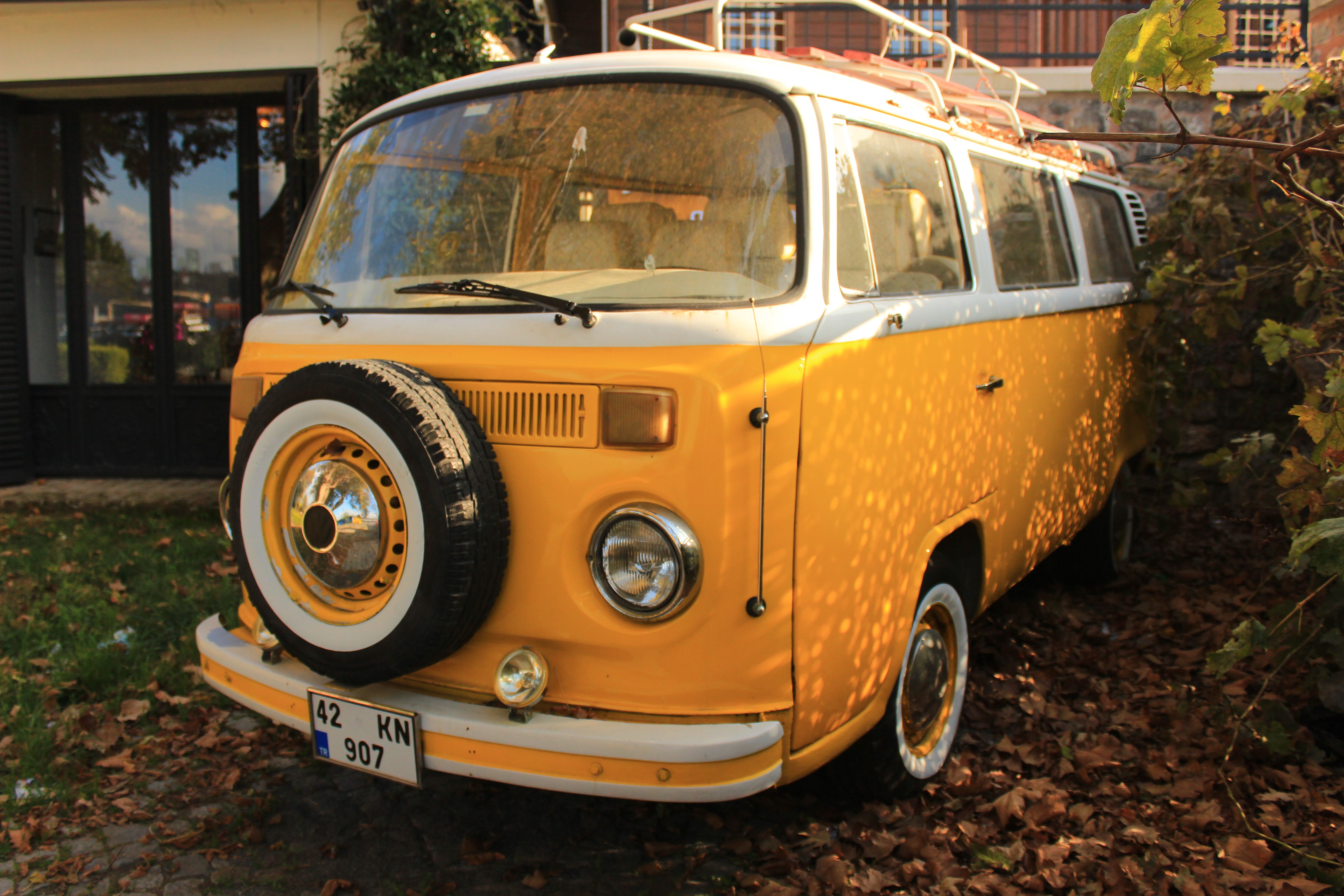 Vintage Yellow Camper Van Parked Outdoors · Free Stock Photo