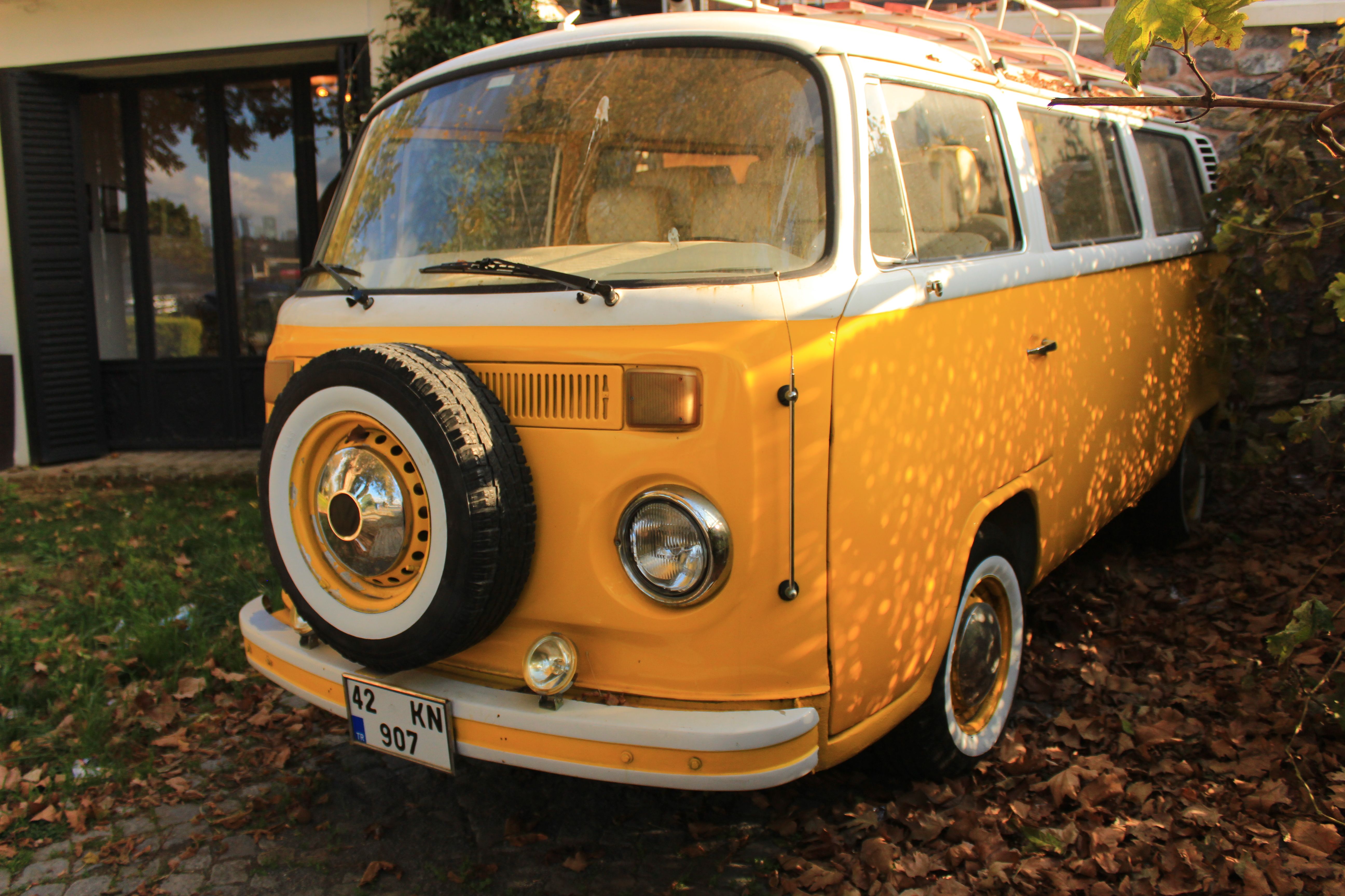 Vintage Yellow Camper Van Parked Outdoors · Free Stock Photo
