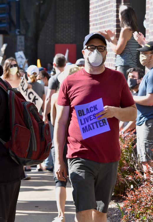 Blm Sign Stop Sign Man Holding BLM Sign at Sidewalk Protest · Free Stock Photo