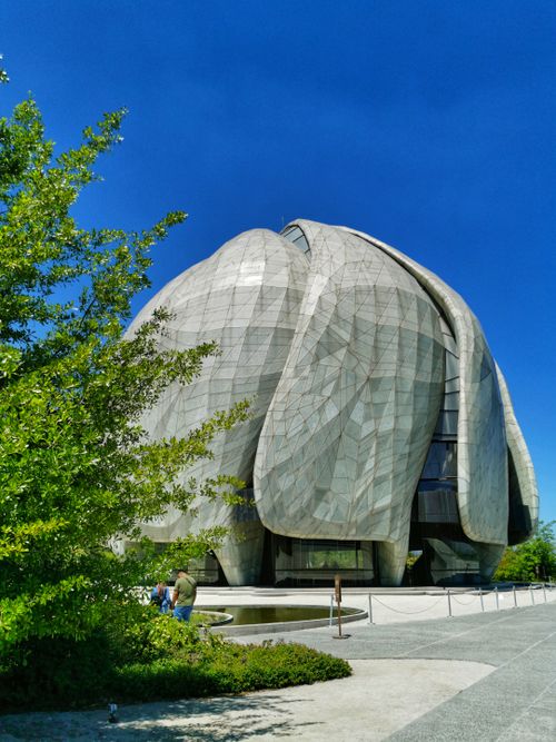 Free Stunning Bahá'í Temple showcasing fluid architecture under a clear blue sky in Peñalolén, Chile. Stock Photo