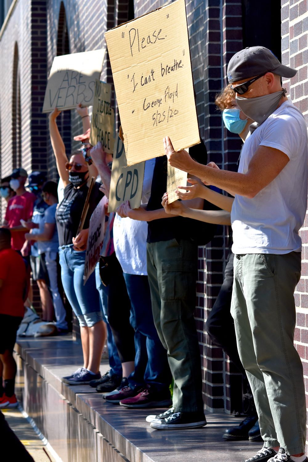 Outdoor Rally Sign Protesters Holding Signs at Outdoor Rally · Free Stock Photo