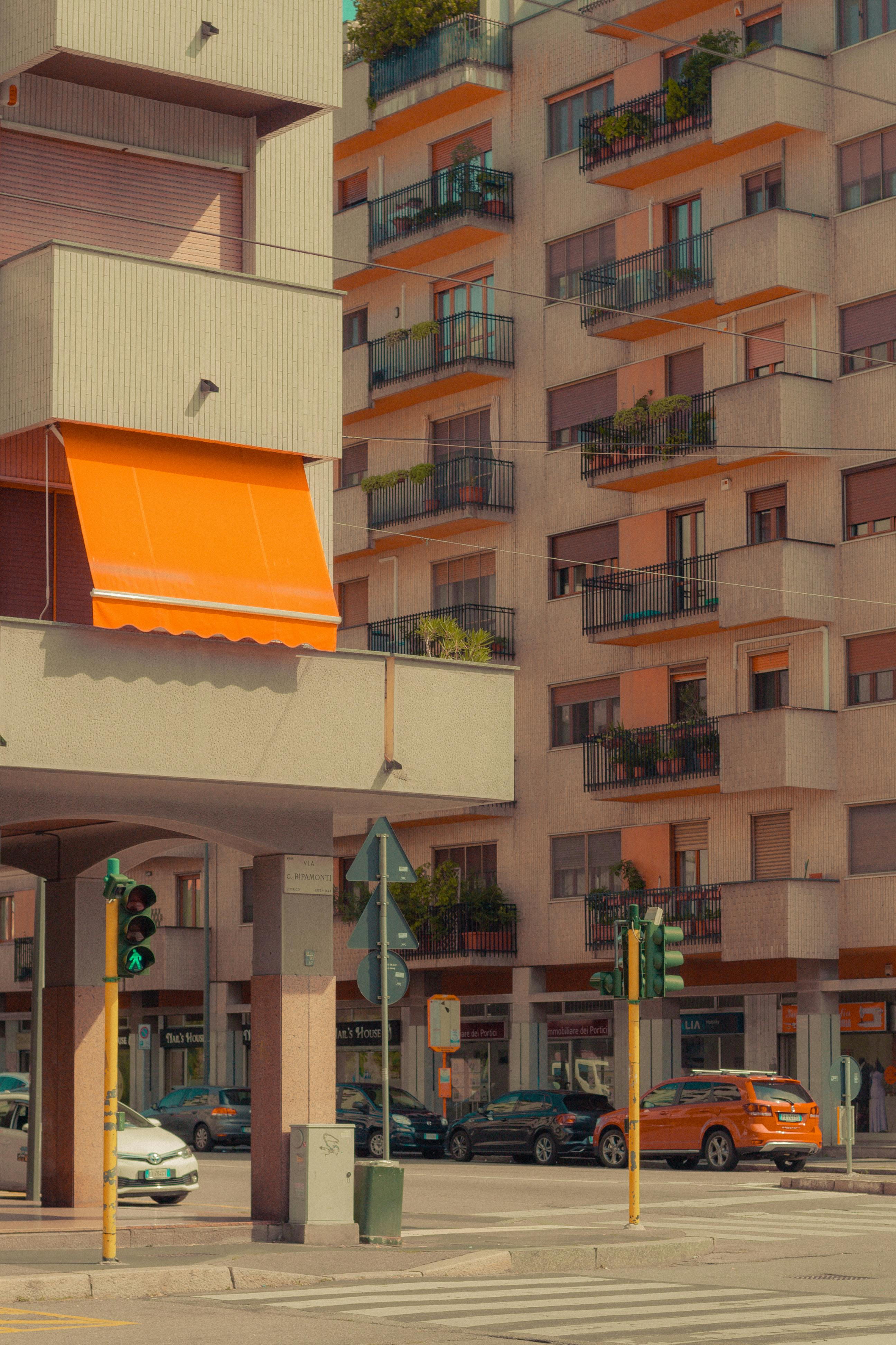 A modern urban scene featuring residential buildings with balconies.