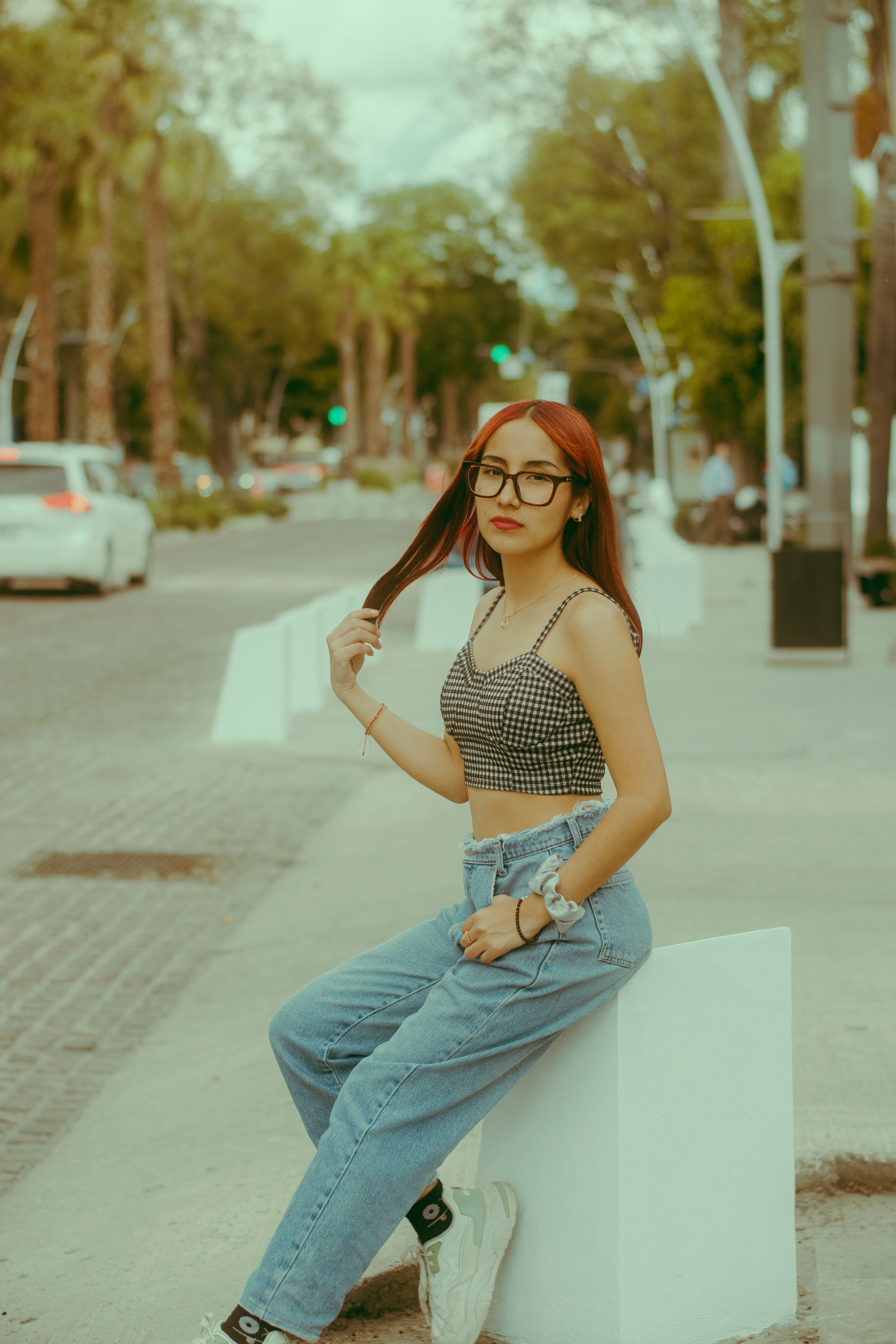 Stylish Young Woman Posing in Urban Street Setting · Free Stock Photo