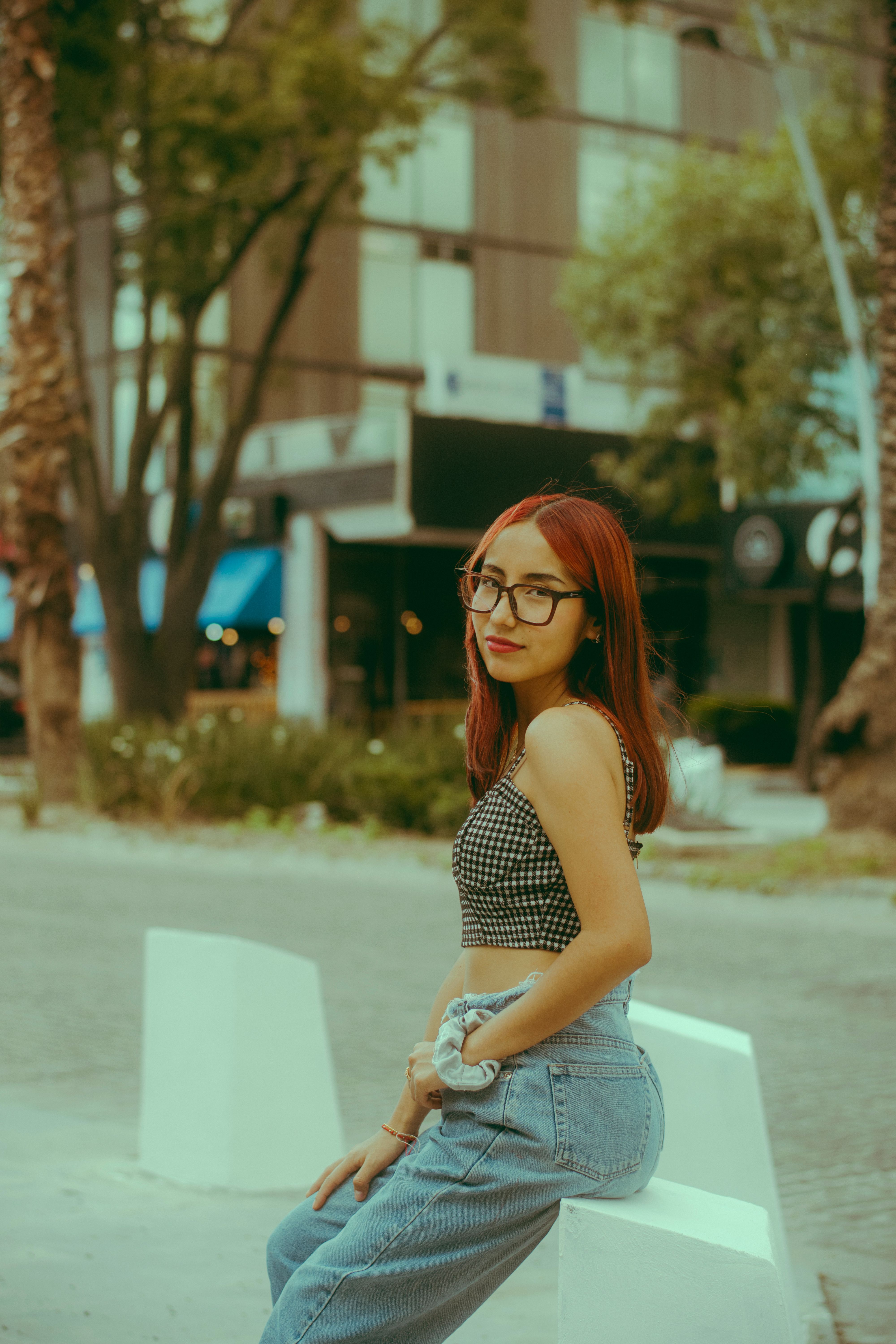 Young Woman Relaxing in Urban Park Setting · Free Stock Photo