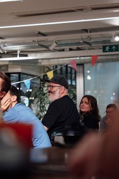 Casual meeting with adults in a modern office, reflecting teamwork and collaboration.
