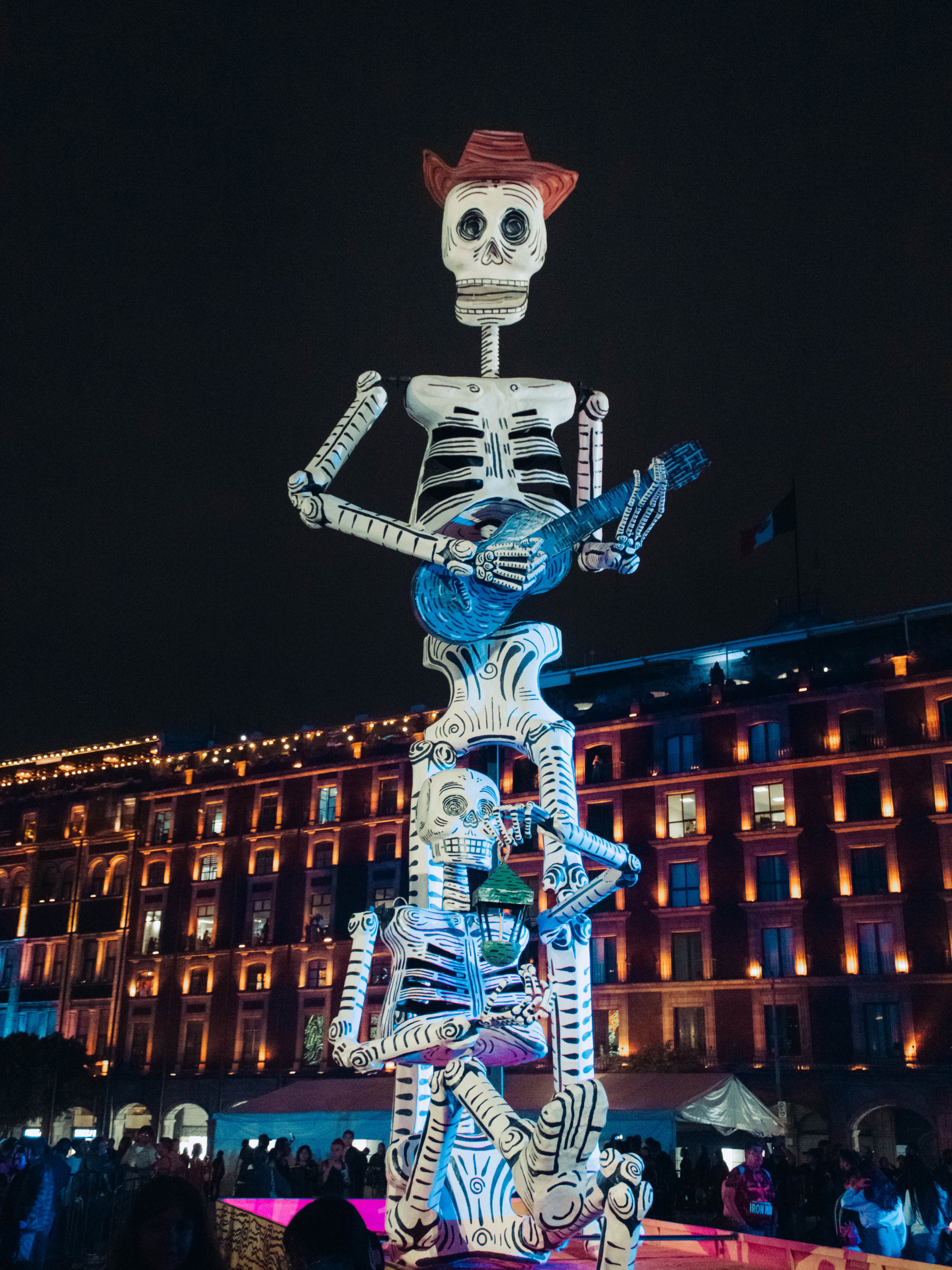 Vibrant Día de Muertos Skeleton Sculpture Night · Free Stock Photo