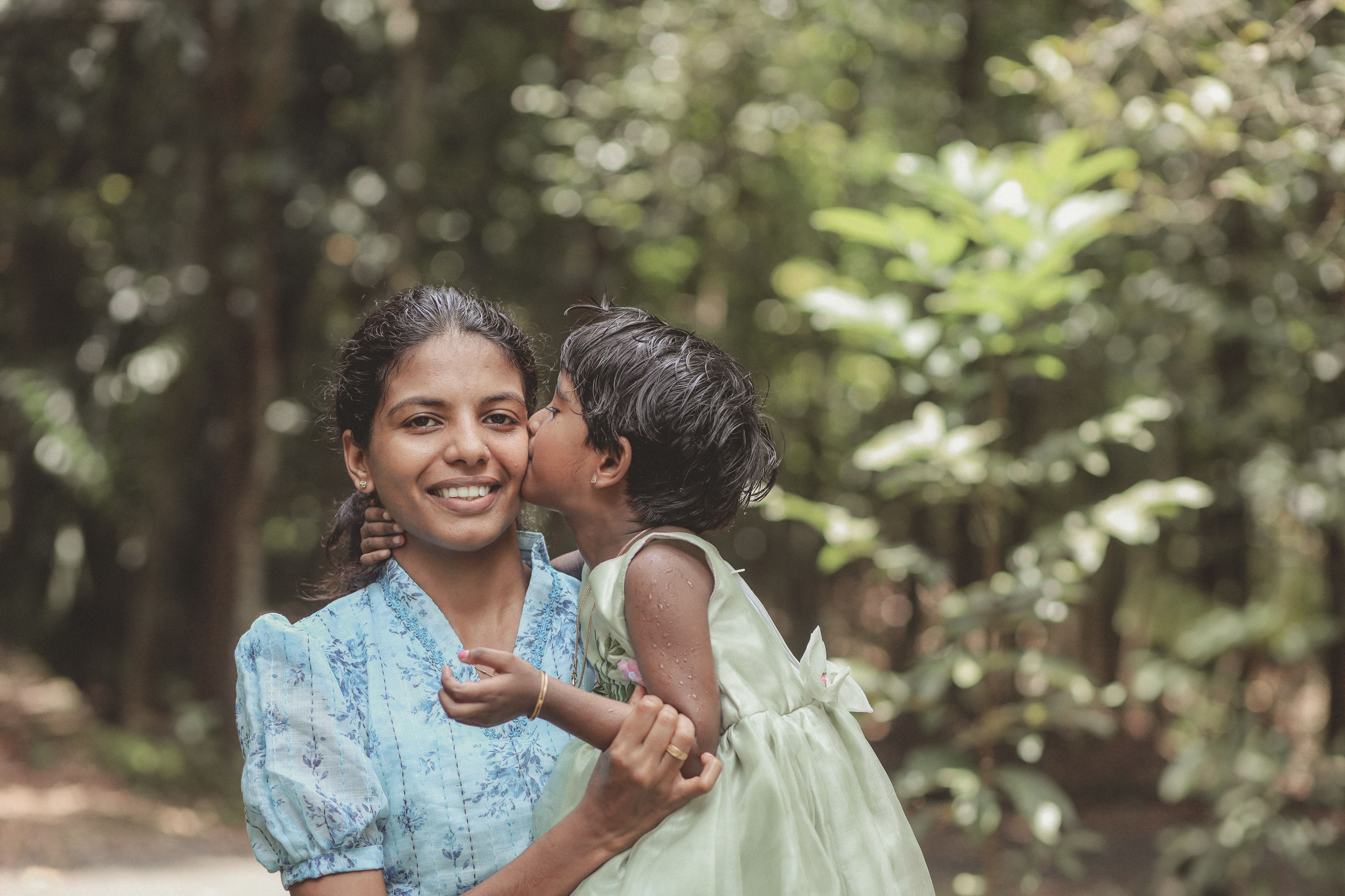 Mother and Child Embracing in Nature · Free Stock Photo