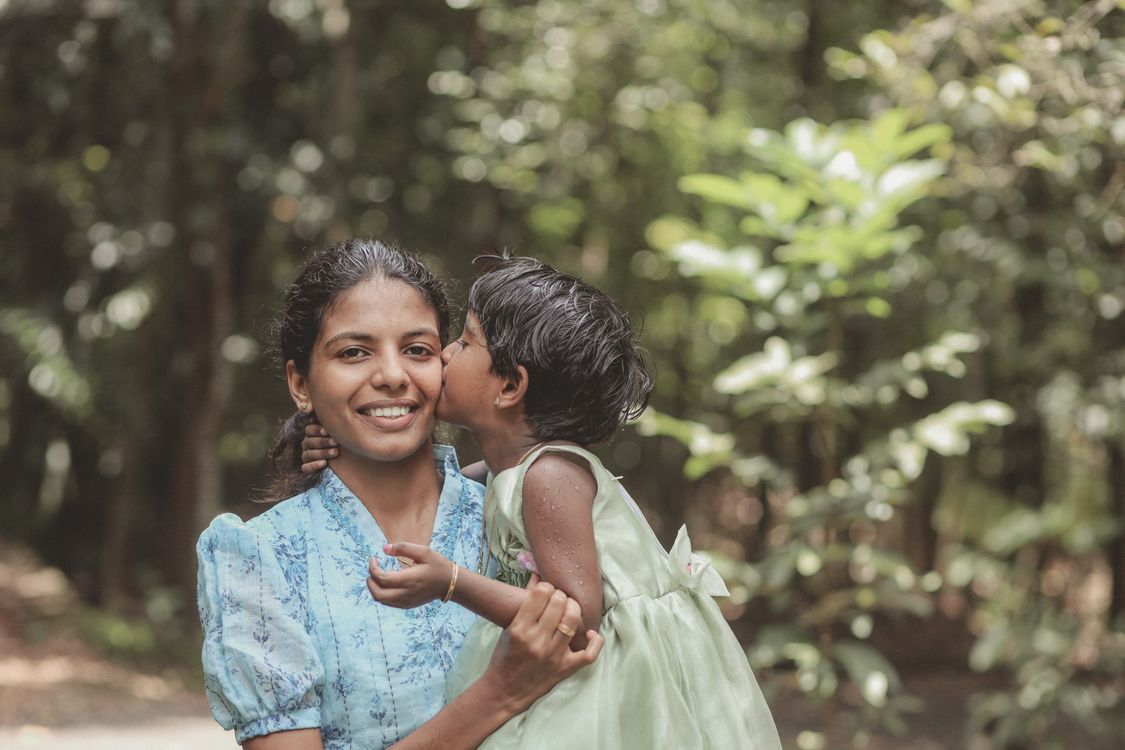Mother and Child Embracing in Nature · Free Stock Photo