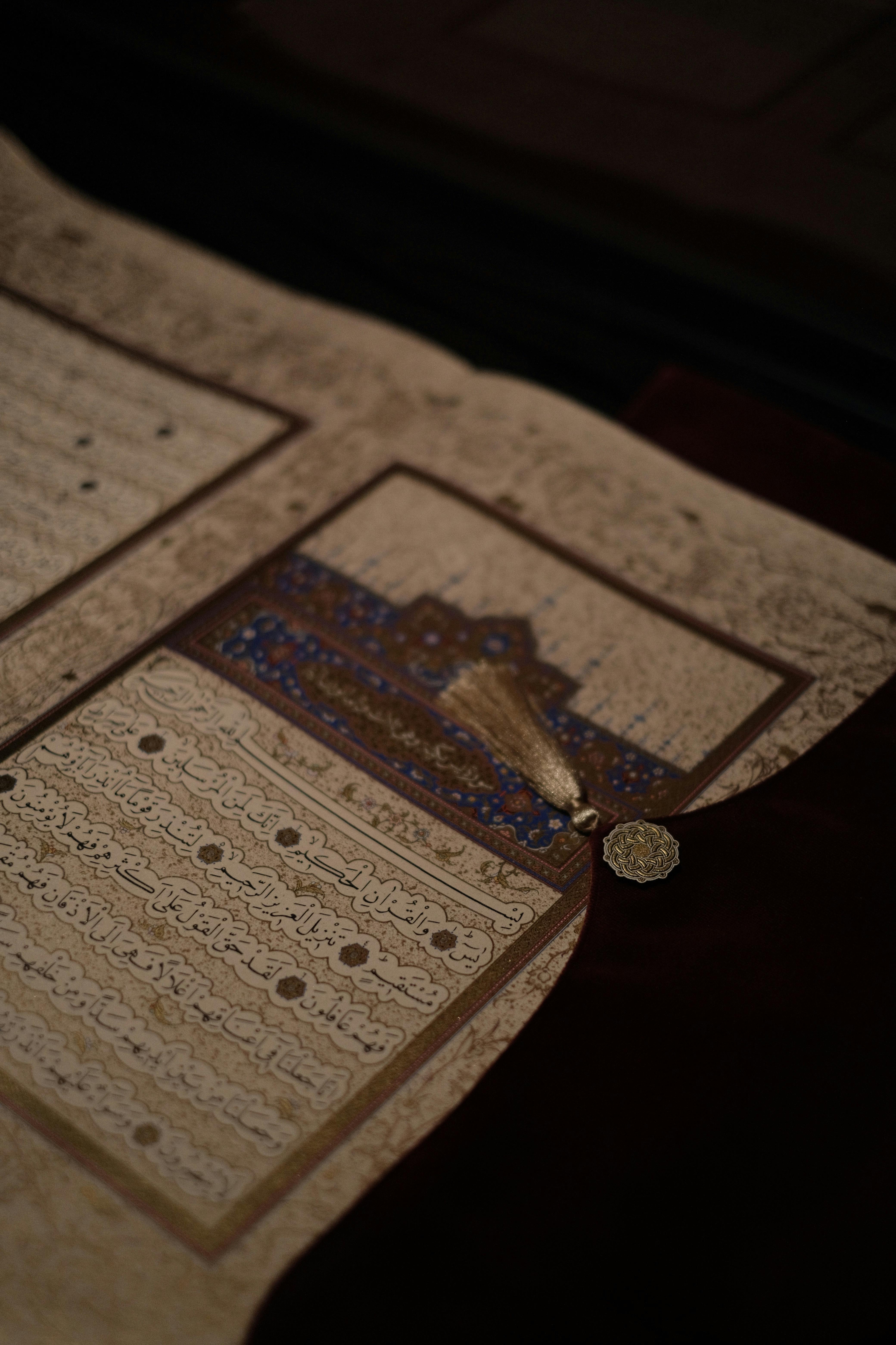 Close-up shot of an ornate ancient manuscript showcasing intricate calligraphy and design.