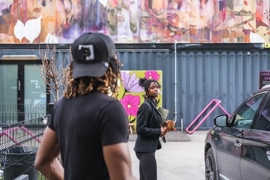 Dynamic street fashion and urban art scene captured in Toronto with vibrant backdrops.