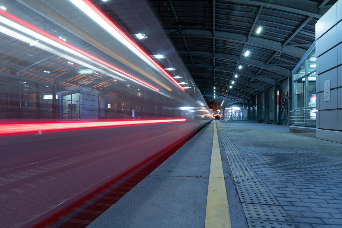 Train Light Effect Dynamic Nighttime Train Station with Motion Blur · Free Stock Photo