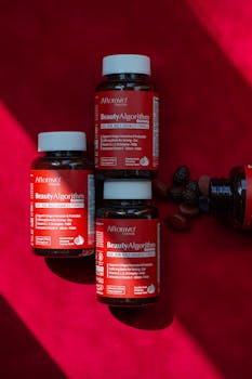 Close-up of Beauty Algorithm Red Bottle photography with shadows and vitamins.