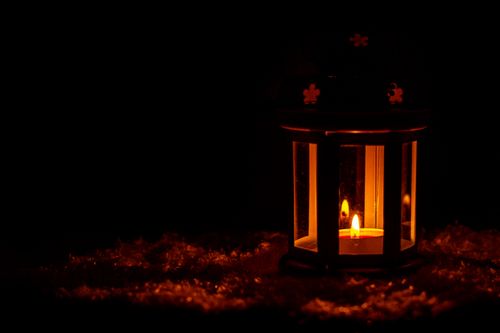 Free A serene lantern provides warm light against a dark background, evoking a sense of calm and tranquility. Stock Photo