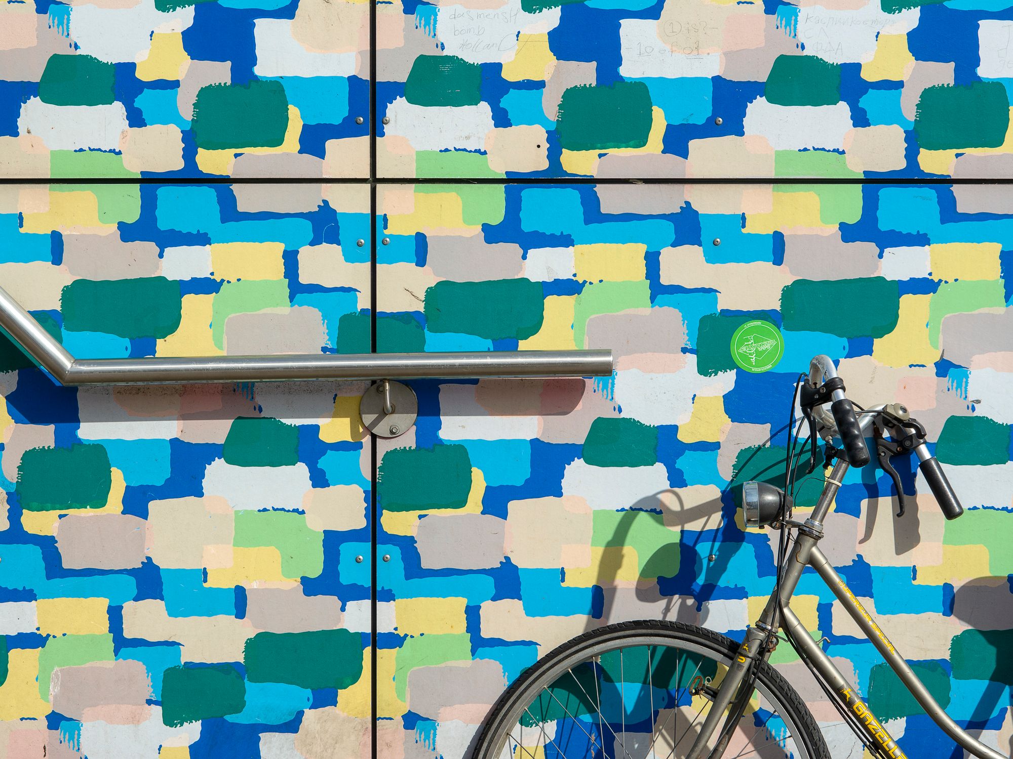 Painters & Decorators in Hoxton, London — professional decorator painting a wall with a roller