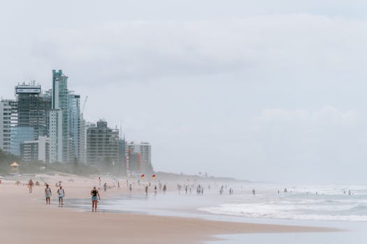 A bustling day at Surfers Paradise with skyscrapers and sandy beach, Australia.