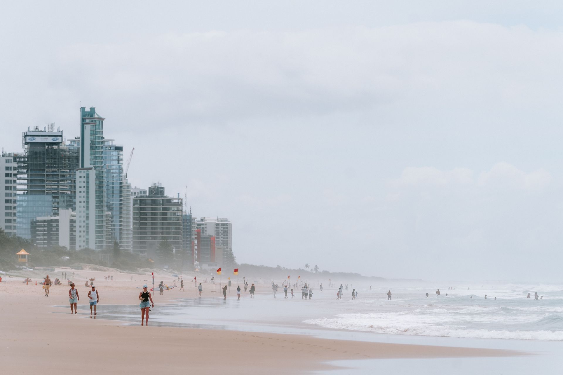 A bustling day at Surfers Paradise with skyscrapers and sandy beach, Australia.