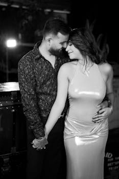 A couple shares an intimate moment during their engagement photoshoot in Toronto.