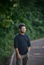 Young Man Strolling on a Leafy Roadside in Bangladesh