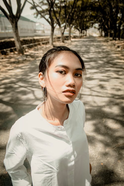 Standing Woman Wearing White Dress Shirt