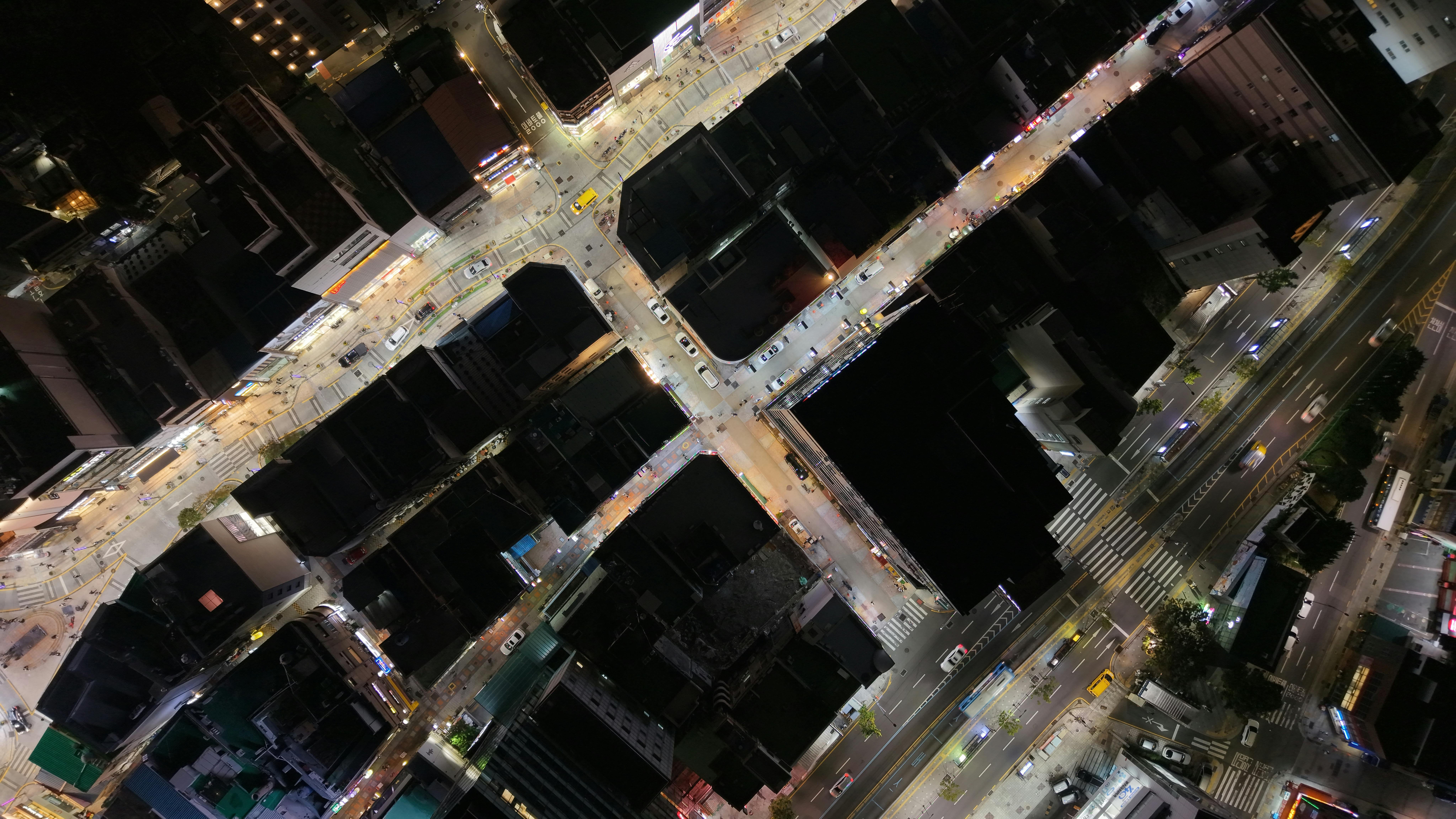 A captivating aerial night view of bustling city streets in Busan, South Korea.