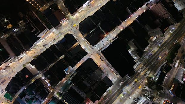 A captivating aerial night view of bustling city streets in Busan, South Korea.