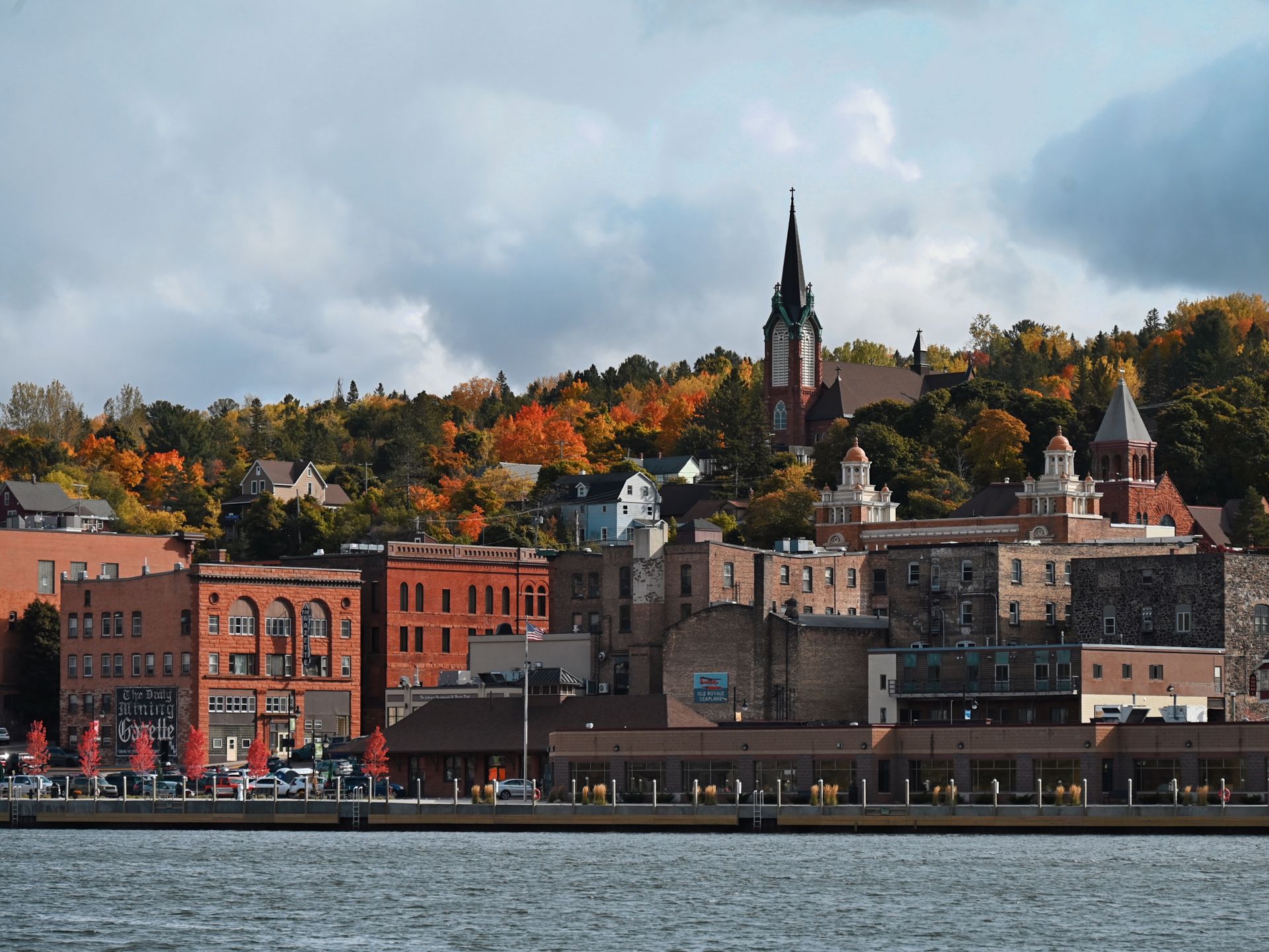 Charming downtown Duluth with fall foliage and historic buildings along the lakeshore.