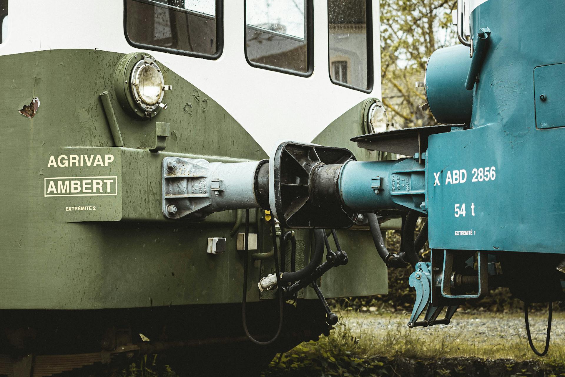 Detailed view of train coupling mechanism with visible branding.