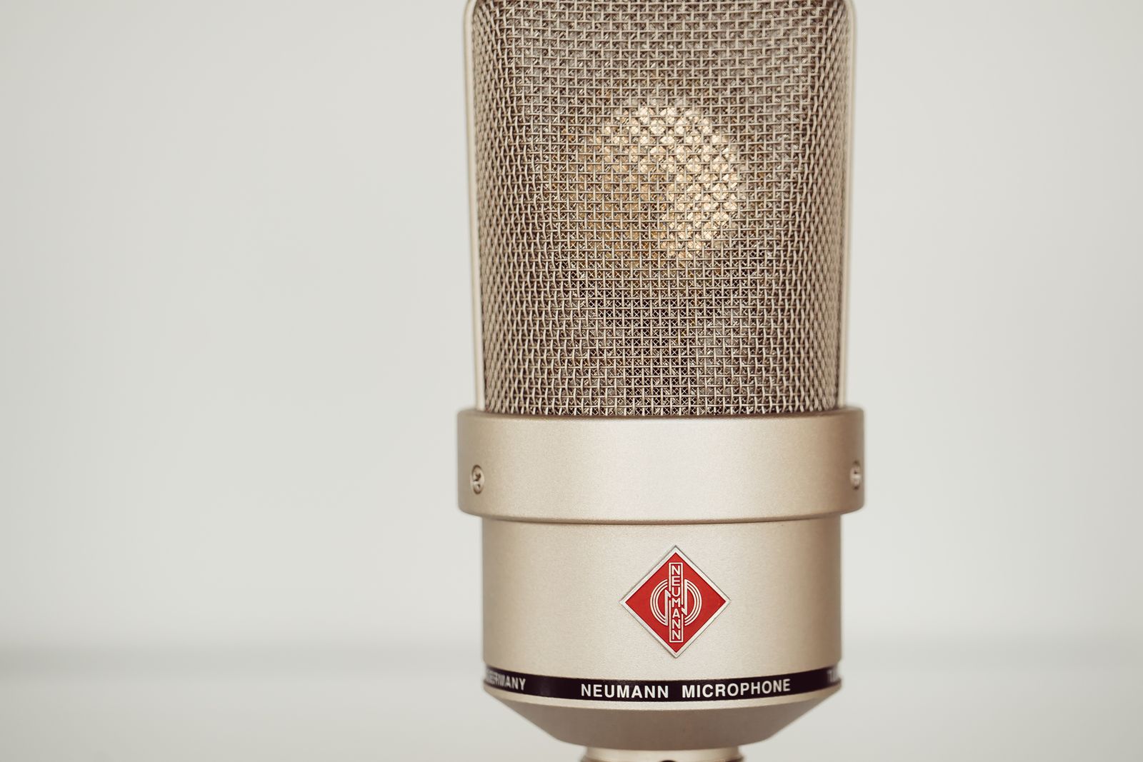 Detailed view of a condenser microphone in a recording studio