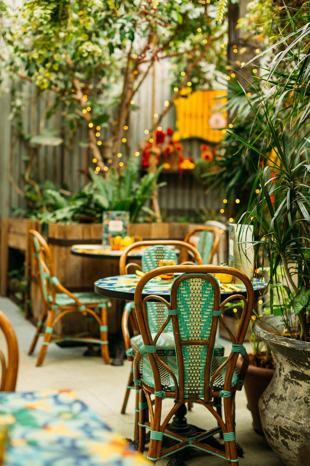Backyard Cafe Cozy Outdoor Cafe Setting Amidst Lush Greenery · Free Stock Photo