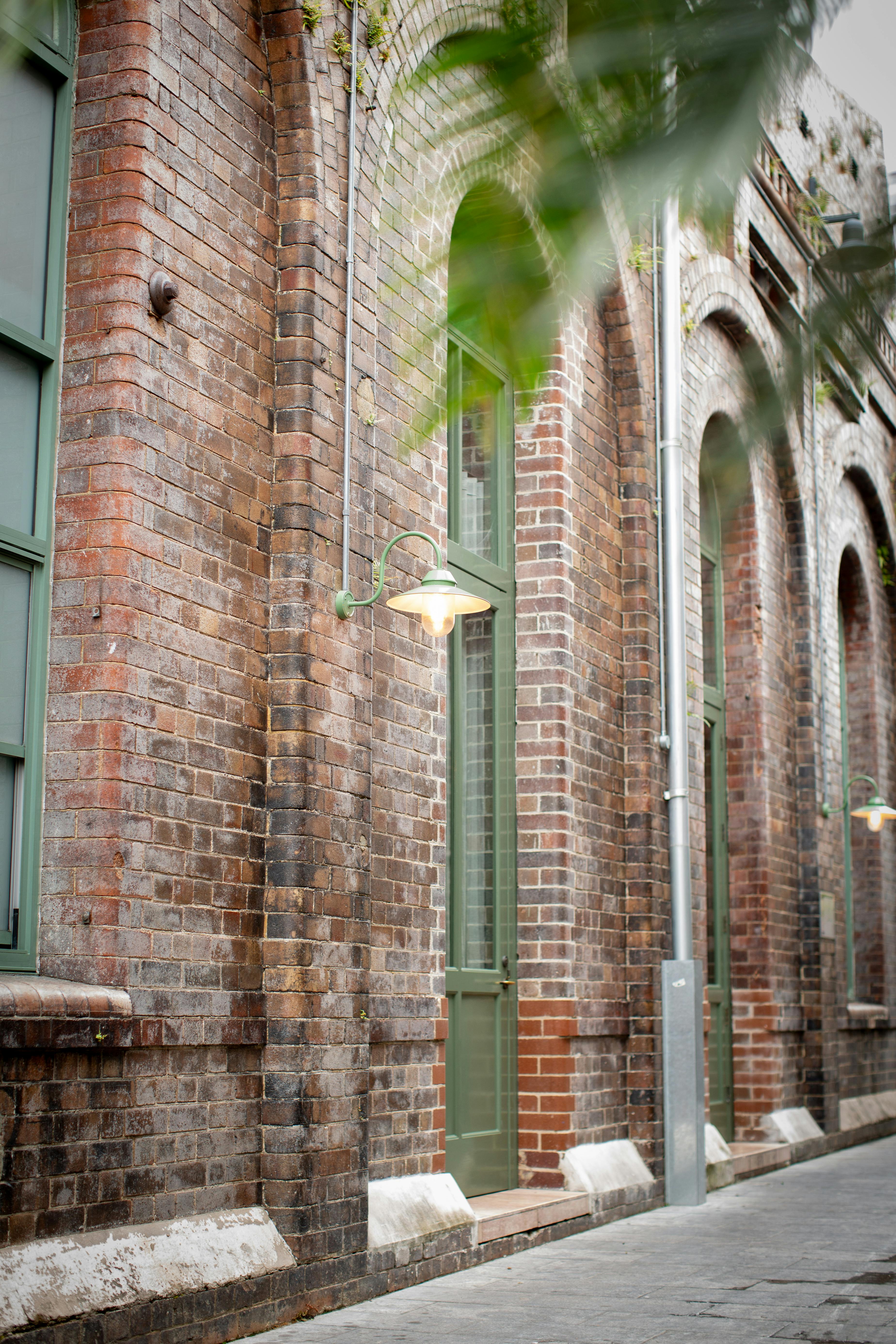 Charming view of historic brick building facade in Alexandria, NSW, showcasing classic architecture.