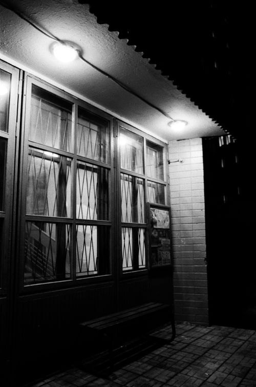 Free Moody black and white photo of a building at night with illuminated windows in Moscow. Stock Photo