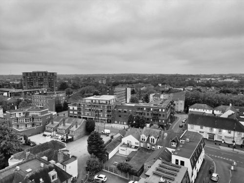 Free Black and white aerial photo of Chelmsford, showing urban buildings and surrounding landscapes. Stock Photo