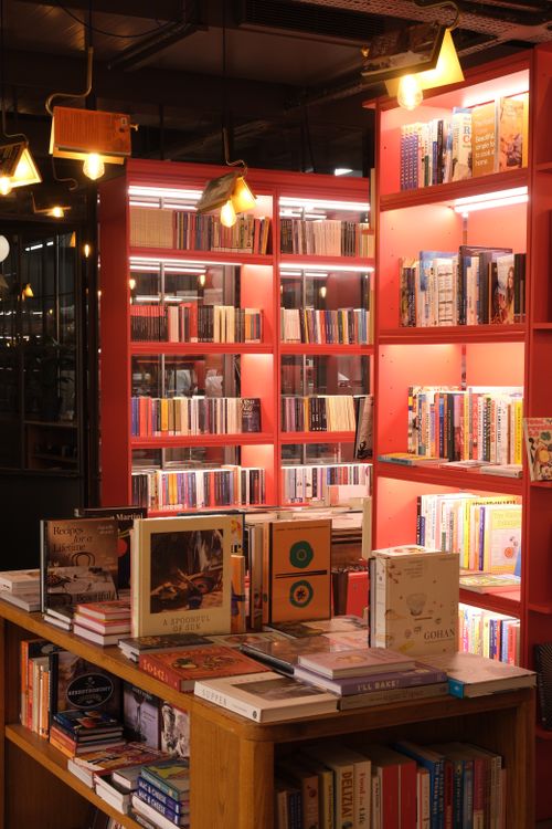 Free Warmly lit bookstore interior in Istanbul with vibrant shelves. Stock Photo