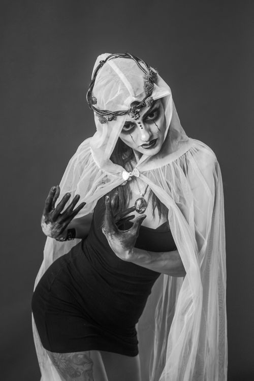 Free Black and white portrait of a person in gothic costume and dramatic makeup. Stock Photo