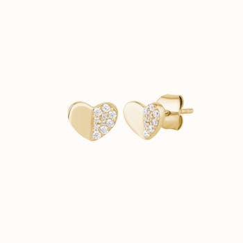 Chic gold heart earrings adorned with diamonds, perfect for a fashion statement.