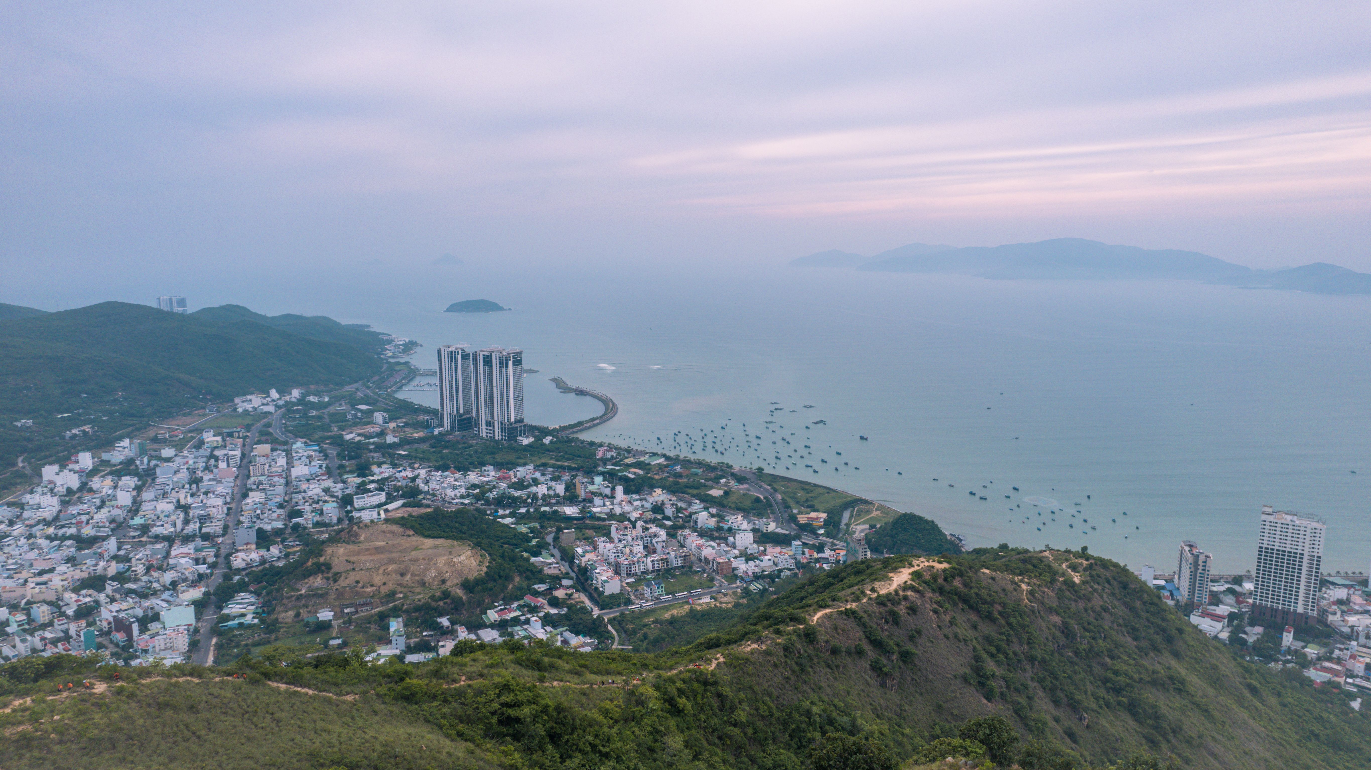 Aerial View of Coastal City and Mountains · Free Stock Photo