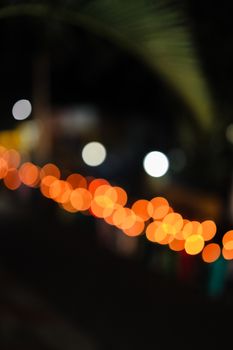 Vibrant bokeh lights creating a delightful abstract pattern captured at night in India.