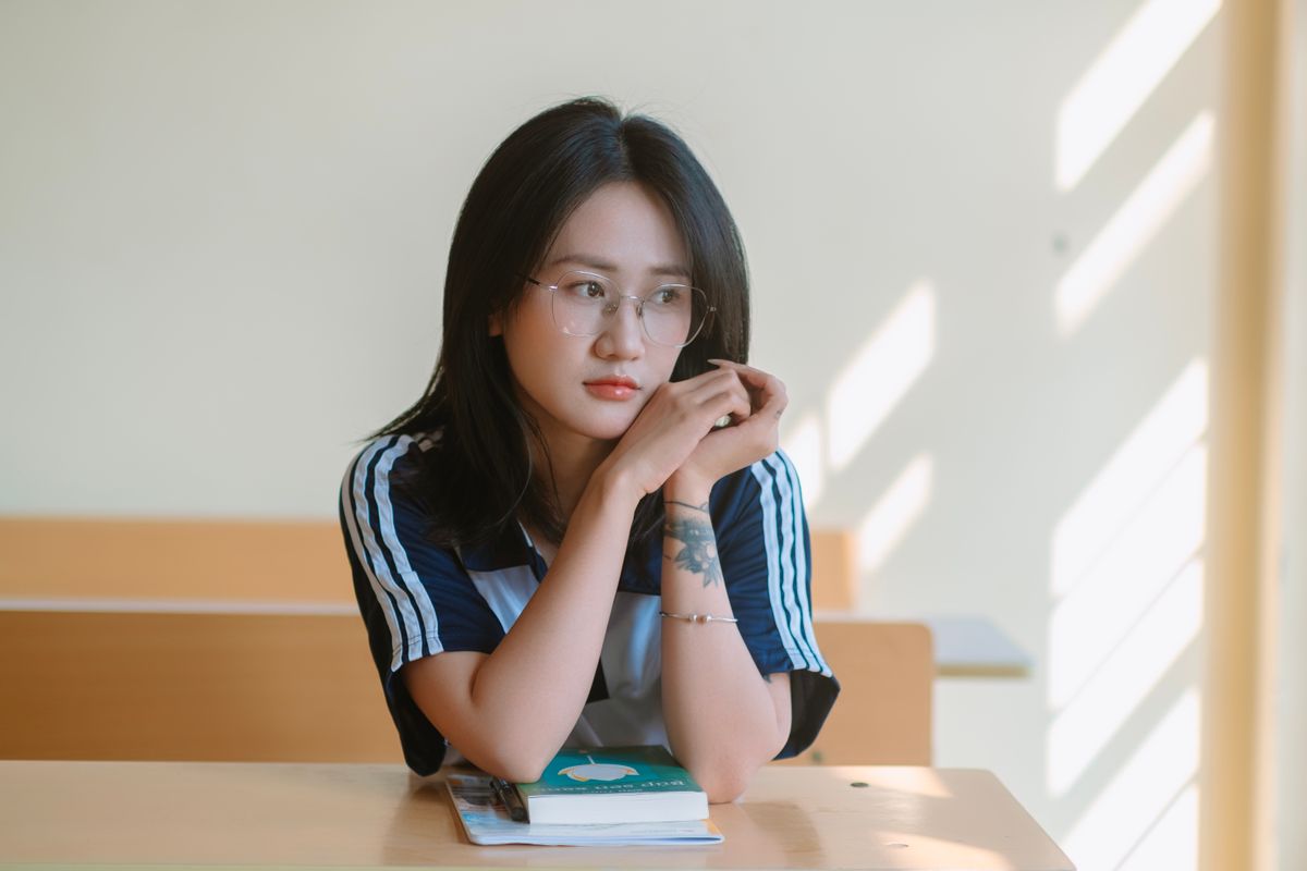 Thoughtful teenage student in a calm classroom setting