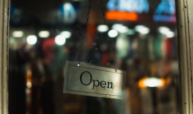 Open sign in a storefront door