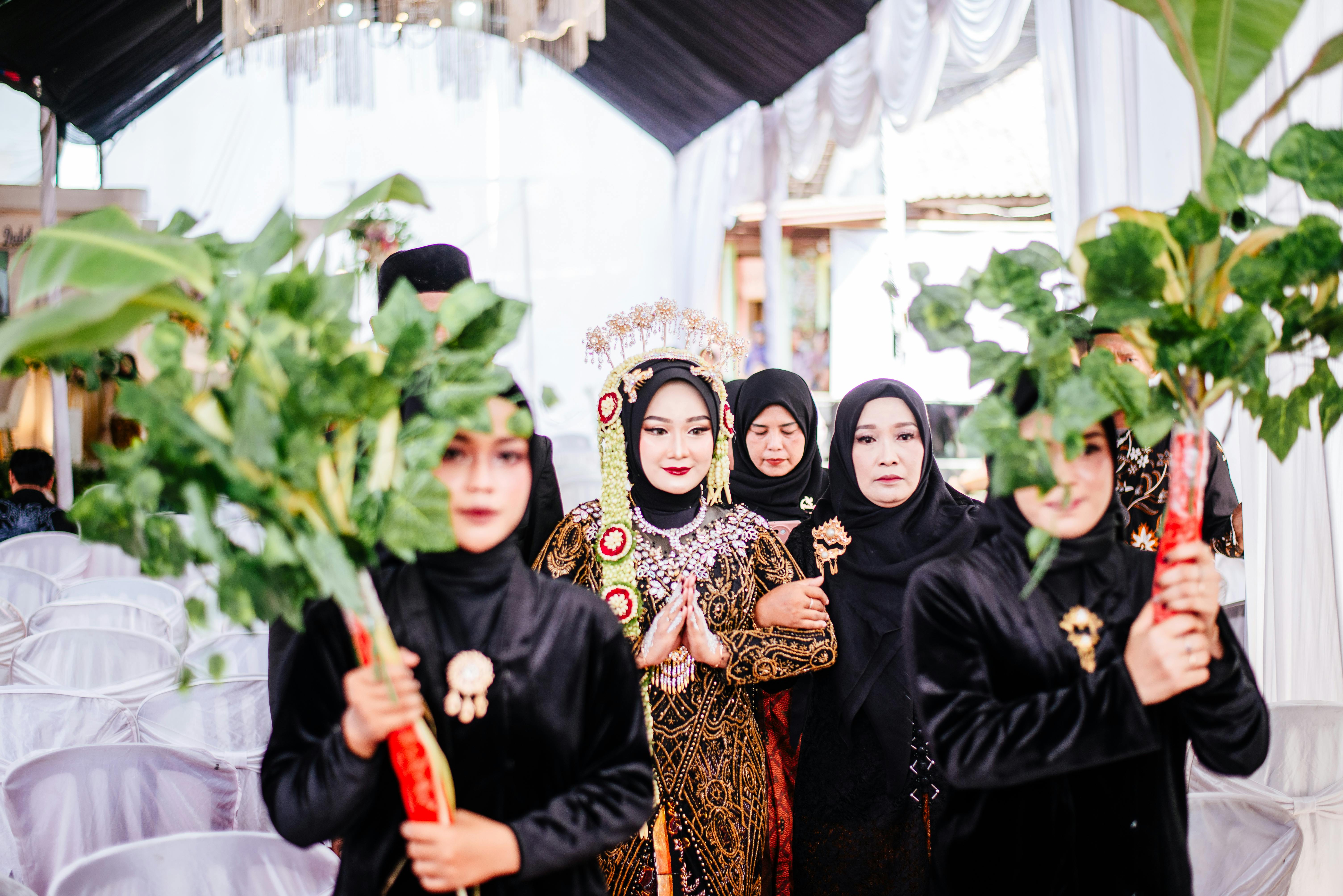 Elegant Javanese wedding ceremony featuring traditional attire and cultural elements.
